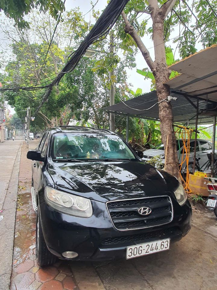 Chính chủ bán xe SANTAFE đăng ký 2009  máy  xăng 12 lít /100km, số tay